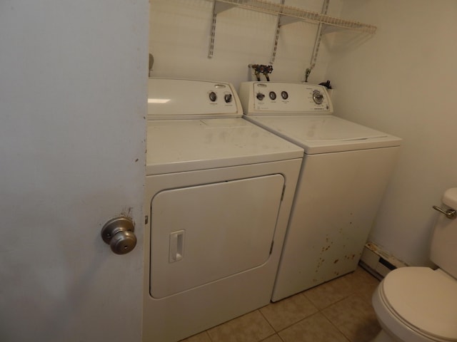 3277 State St, White Haven, PA 18661 - laundry room with washer and dryer, light tile patterned floors, and a baseboard radiator
