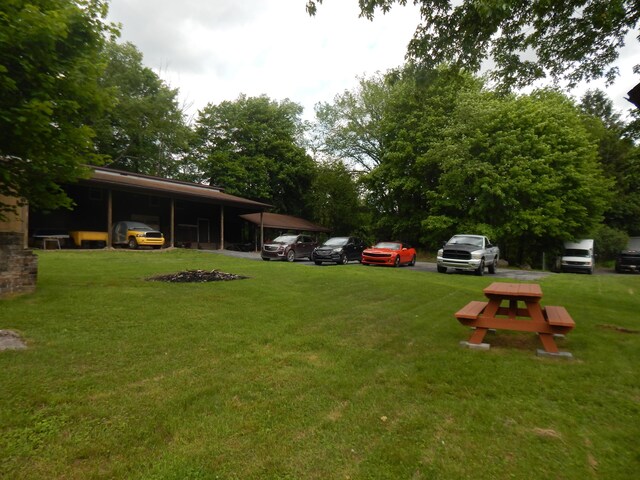3277 State St, White Haven, PA 18661 - view of green lawn with a carport