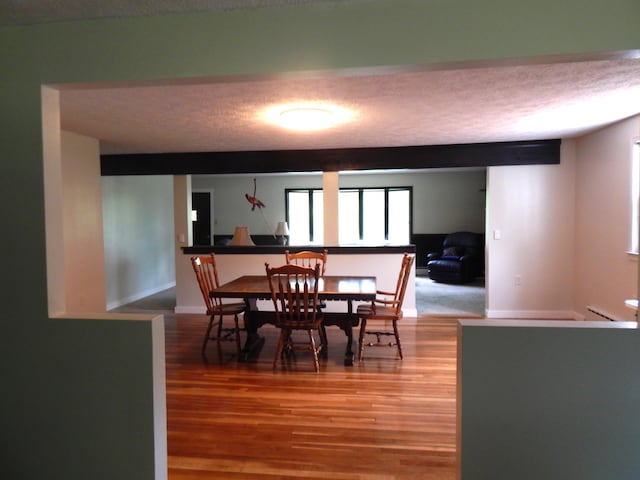 3277 State St, White Haven, PA 18661 - dining area with wood finished floors and a textured ceiling
