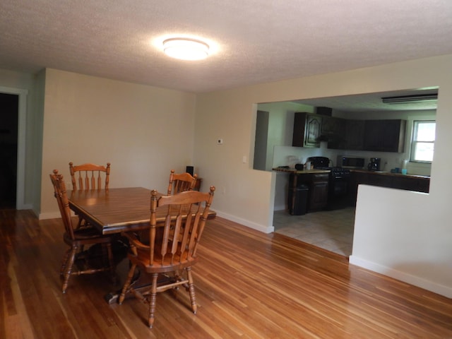 3277 State St, White Haven, PA 18661 - dining area featuring light wood-style floors and a textured ceiling