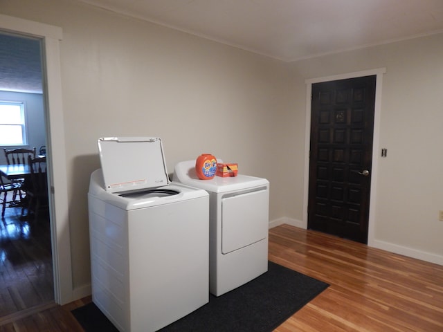 3277 State St, White Haven, PA 18661 - laundry room with washer and clothes dryer, wood finished floors, and ornamental molding