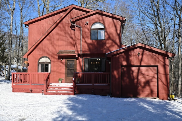 rustic home featuring a garage and a porch