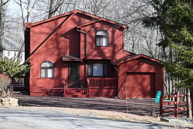 chalet / cabin featuring an attached garage