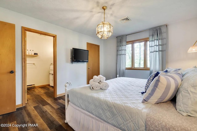 bedroom featuring dark wood-style flooring, visible vents, and baseboards