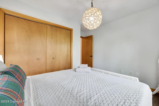 bedroom featuring a closet and baseboards