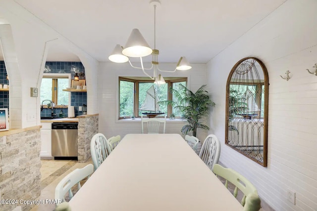 dining area with an inviting chandelier