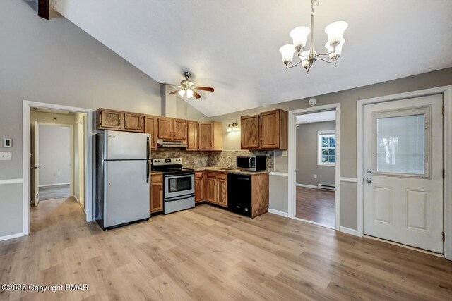 kitchen featuring light hardwood / wood-style flooring, ceiling fan with notable chandelier, stainless steel appliances, decorative backsplash, and decorative light fixtures