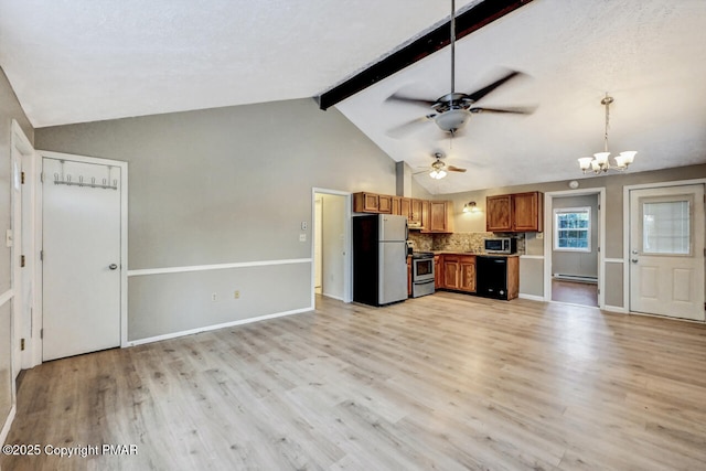 kitchen featuring decorative light fixtures, lofted ceiling with beams, light wood-type flooring, stainless steel appliances, and backsplash