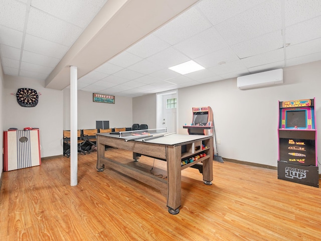 1533 Black Birch Way, Tobyhanna, PA 18466 - game room with an AC wall unit, light wood-style flooring, and a paneled ceiling