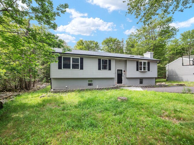 1533 Black Birch Way, Tobyhanna, PA 18466 - split foyer home with a chimney, a front lawn, and entry steps