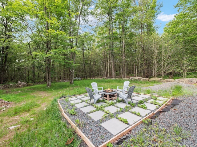 1533 Black Birch Way, Tobyhanna, PA 18466 - view of yard with an outdoor fire pit, a patio, and a wooded view