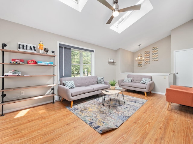 1533 Black Birch Way, Tobyhanna, PA 18466 - living area with a skylight, a chandelier, wood finished floors, a ceiling fan, and high vaulted ceiling
