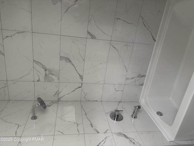 full bathroom with tiled shower