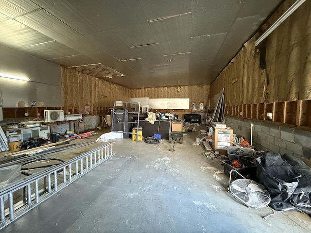 garage with concrete block wall