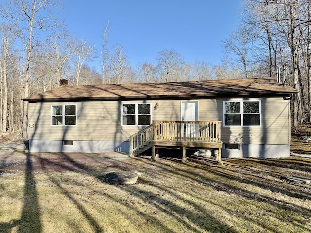 back of house featuring crawl space, a chimney, and a wooden deck