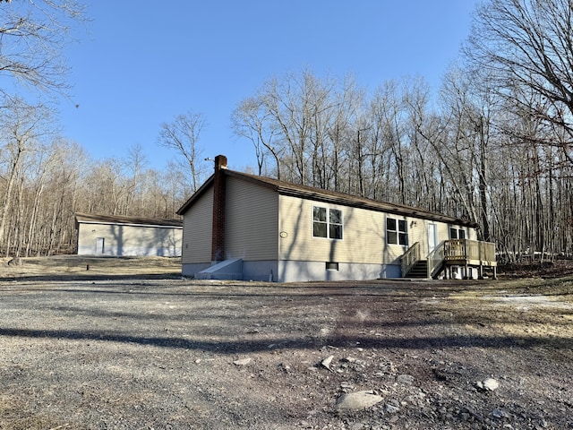 view of home's exterior featuring a chimney