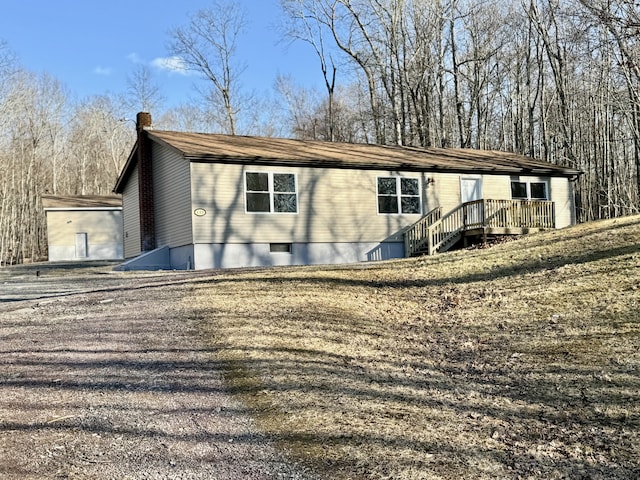 view of front of home featuring a chimney