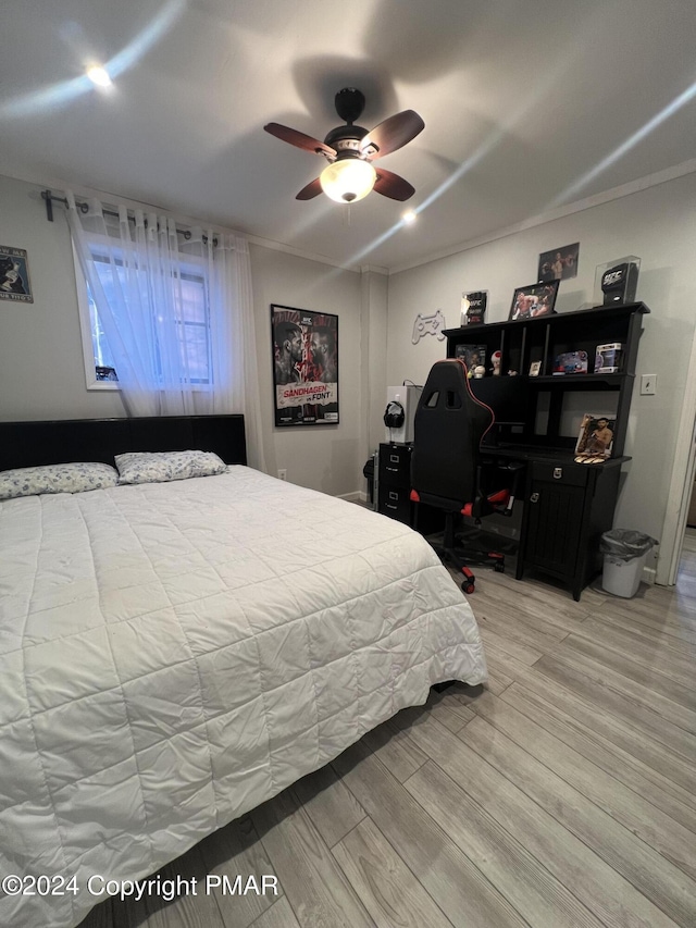 bedroom featuring a ceiling fan and light wood-style floors