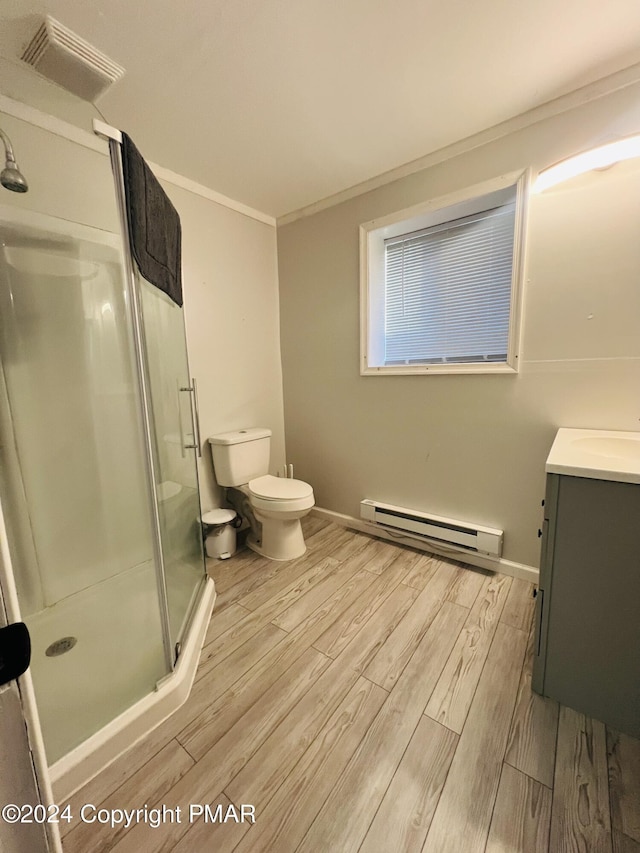 bathroom featuring a stall shower, visible vents, toilet, a baseboard radiator, and wood finished floors