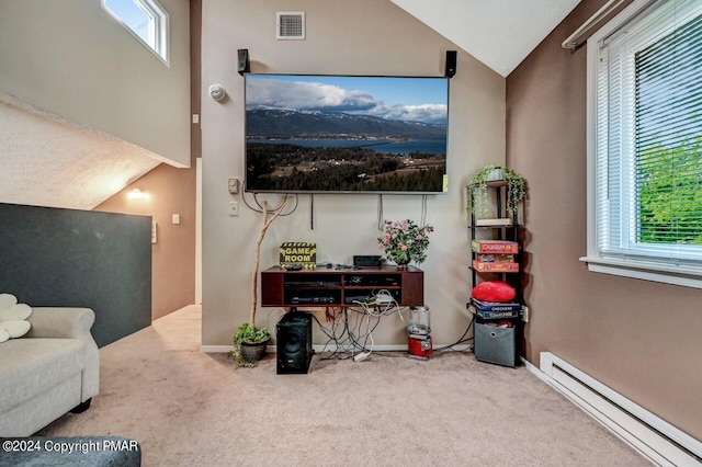 interior space with visible vents, a baseboard heating unit, vaulted ceiling, and baseboards