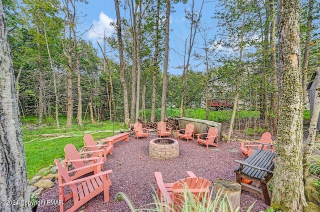 view of patio / terrace with an outdoor fire pit