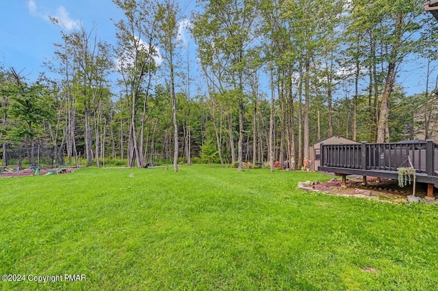 view of yard with a deck