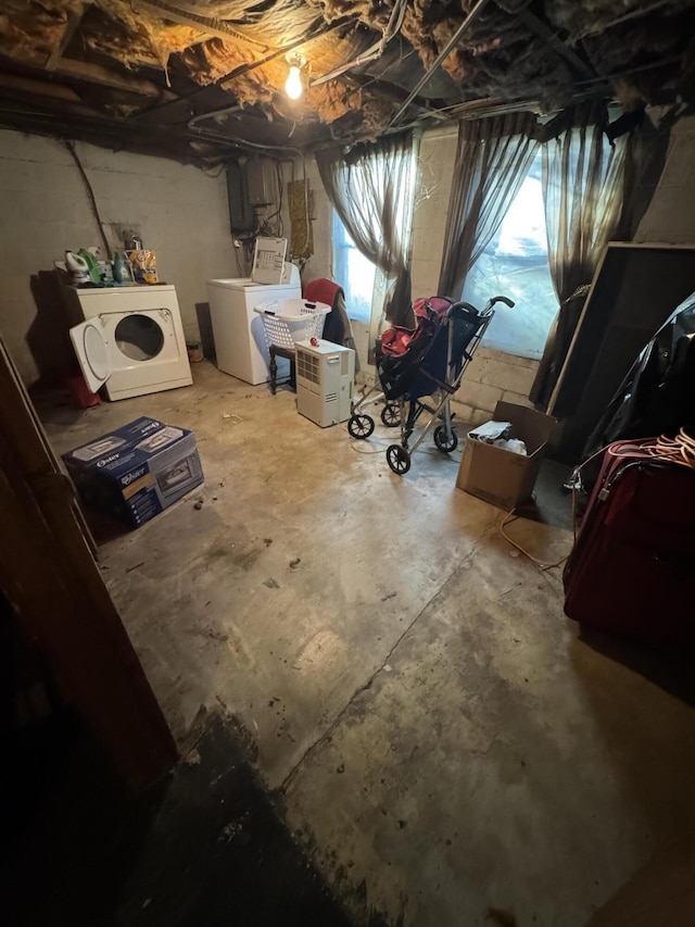 below grade area with washing machine and clothes dryer