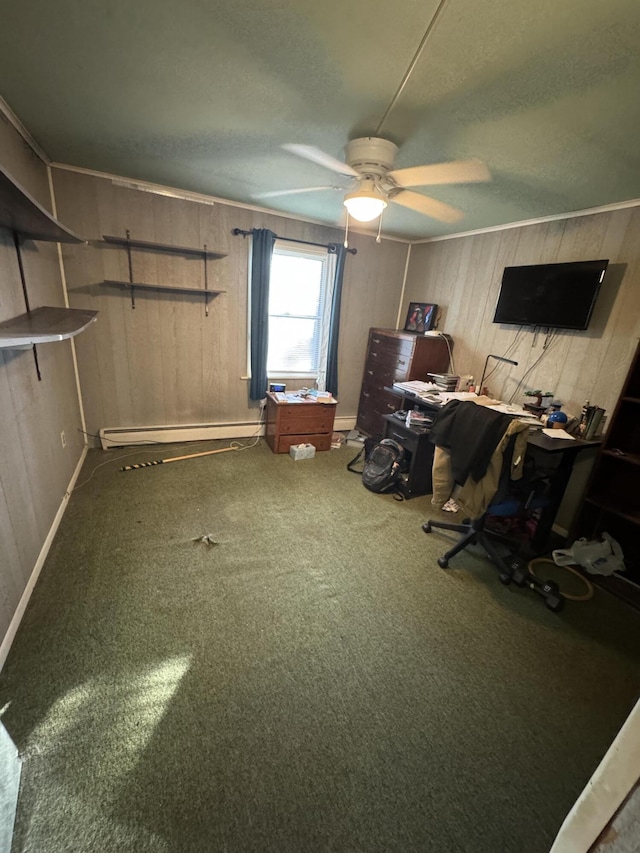 home office with a textured ceiling, ceiling fan, wood walls, and carpet