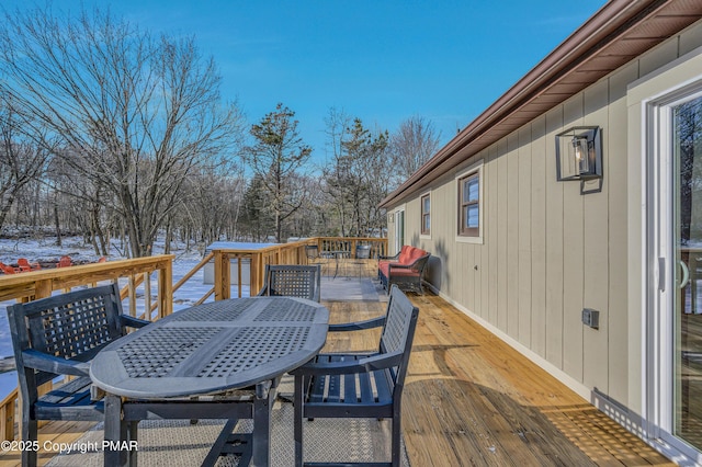 deck featuring outdoor dining area