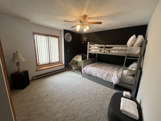 bedroom featuring a textured ceiling, ceiling fan, baseboard heating, and carpet flooring