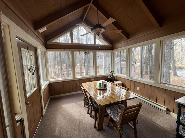 sunroom / solarium featuring a ceiling fan, wood ceiling, plenty of natural light, and lofted ceiling with beams