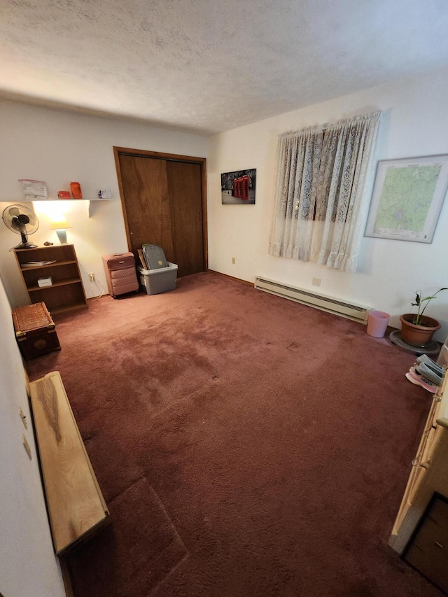 457 Maxatawny Dr, Pocono Lake, PA 18347 - living room featuring baseboard heating, carpet flooring, and a textured ceiling