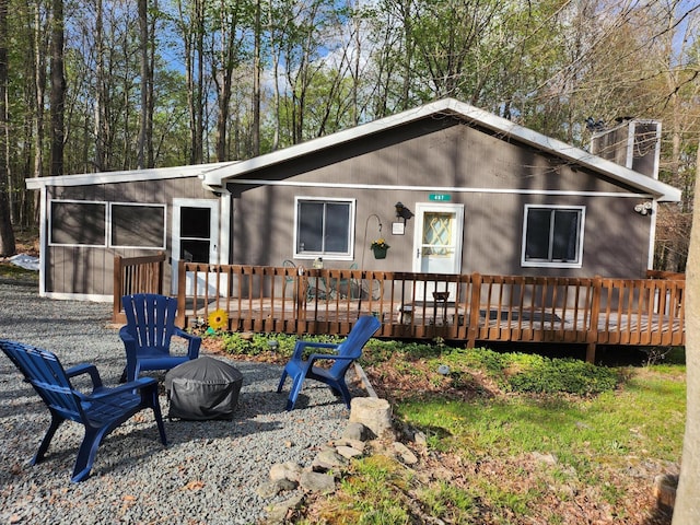 457 Maxatawny Dr, Pocono Lake, PA 18347 - back of house with a wooden deck and a chimney