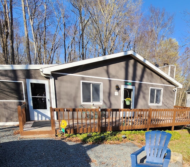 457 Maxatawny Dr, Pocono Lake, PA 18347 - back of house with a chimney and a wooden deck