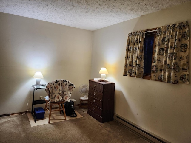 carpeted office featuring a textured ceiling and a baseboard radiator