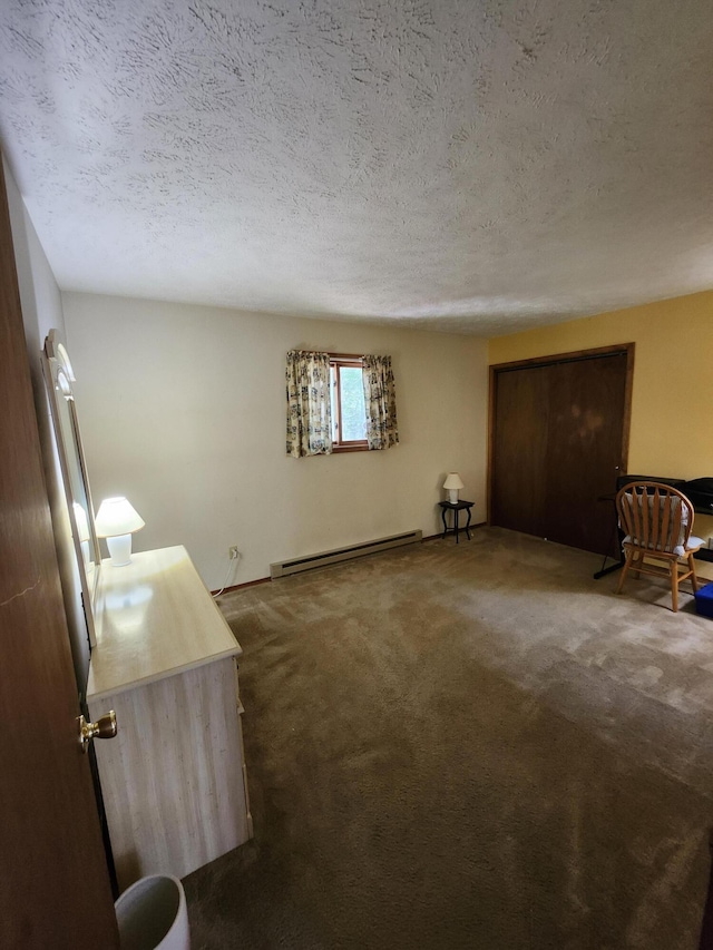 457 Maxatawny Dr, Pocono Lake, PA 18347 - unfurnished living room with a baseboard heating unit, dark colored carpet, and a textured ceiling