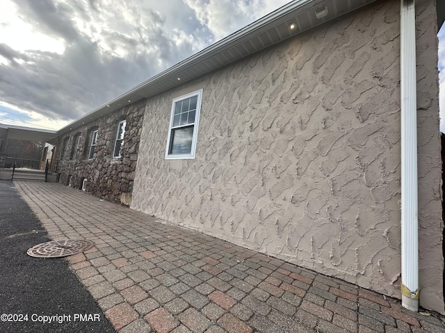 view of property exterior with stucco siding