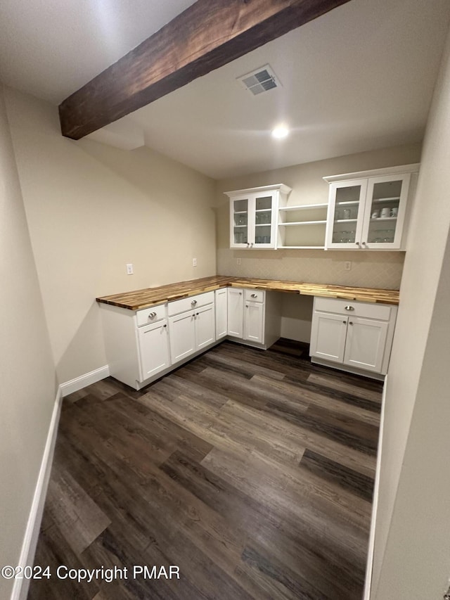 kitchen featuring built in desk, butcher block counters, beam ceiling, open shelves, and dark wood-style floors