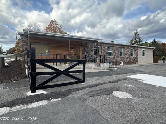 view of front of property featuring stone siding