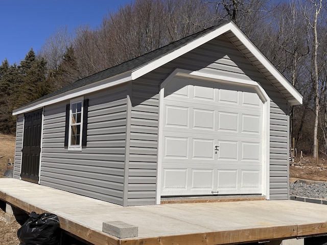 garage with a view of trees