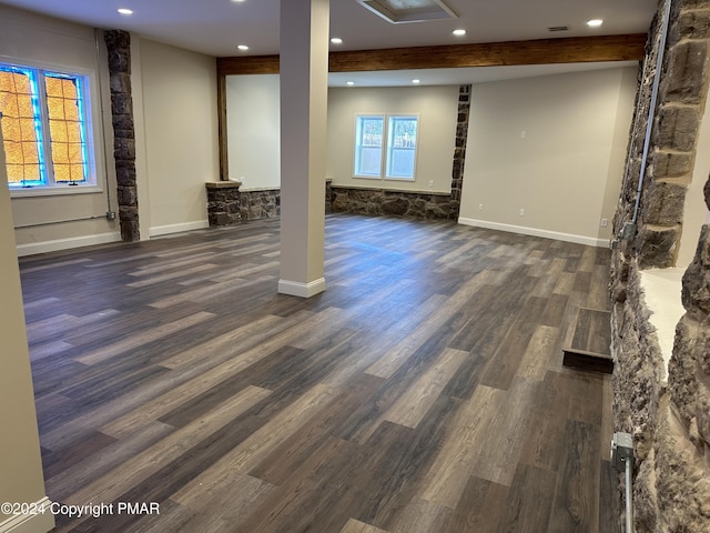 below grade area with recessed lighting, baseboards, and dark wood finished floors