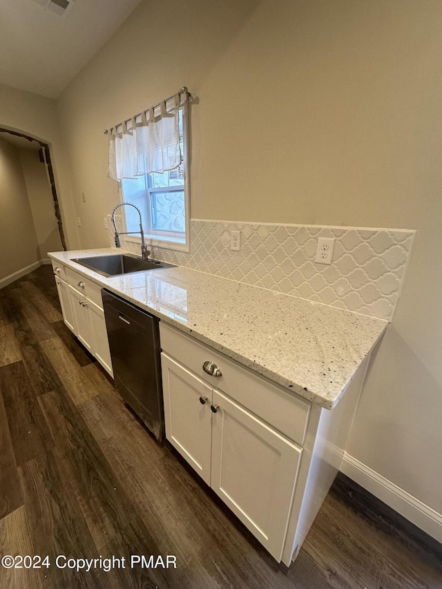 kitchen featuring dishwasher, a sink, white cabinetry, and dark wood-style floors