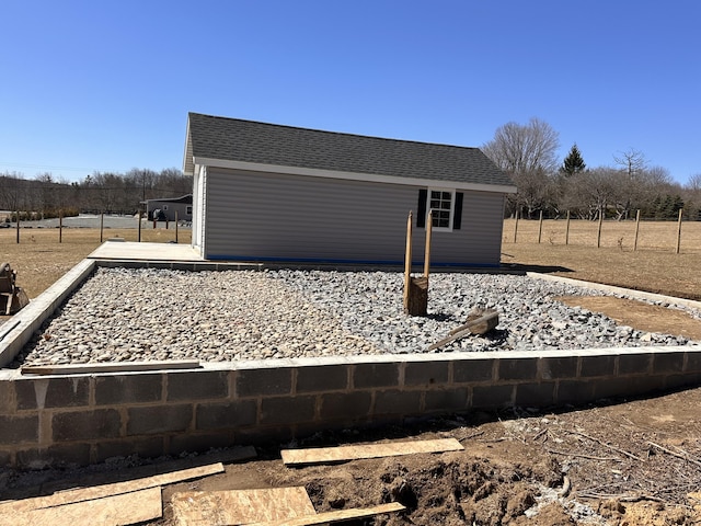 exterior space with a shingled roof