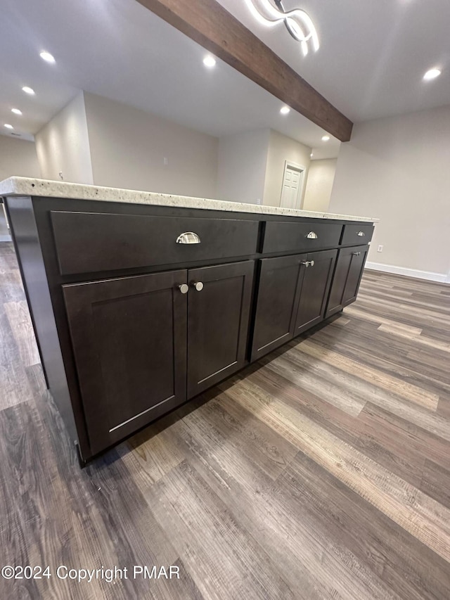 interior details featuring recessed lighting, beam ceiling, baseboards, and wood finished floors