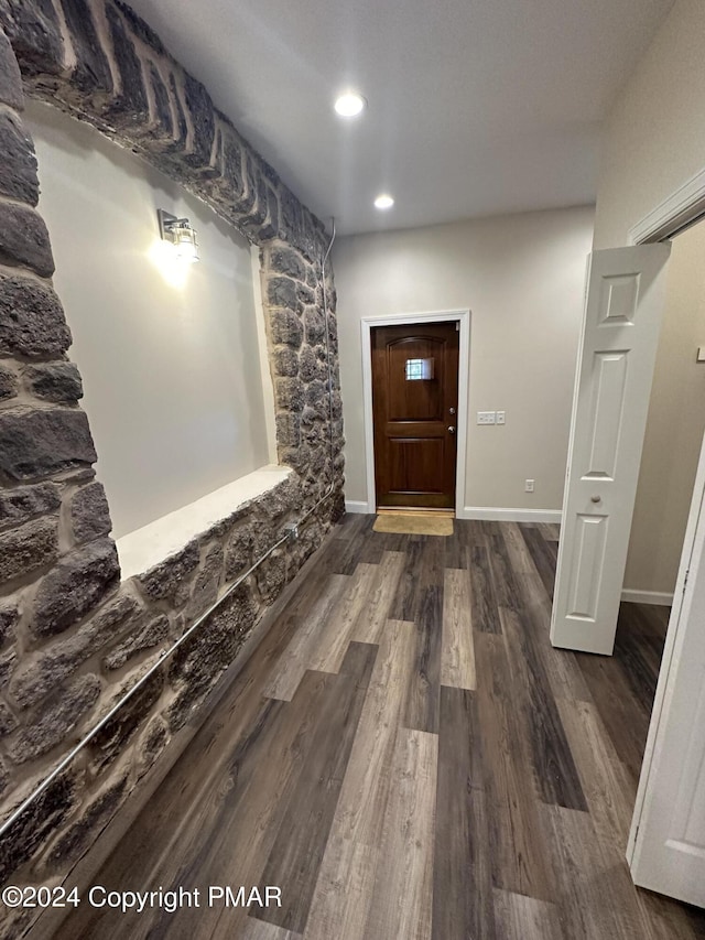 interior space with baseboards, dark wood-style flooring, and recessed lighting