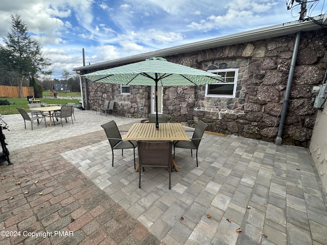 view of patio featuring outdoor dining area