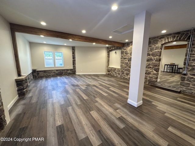 below grade area featuring baseboards, recessed lighting, and dark wood finished floors