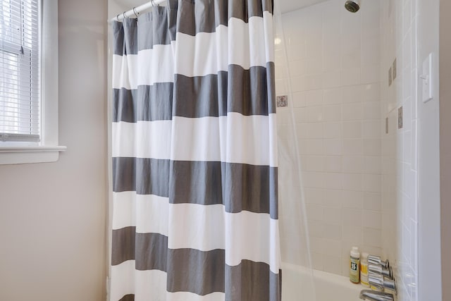 full bathroom with shower / tub combo