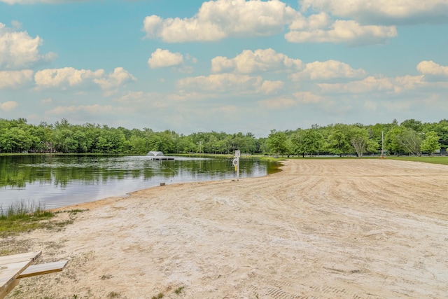 property view of water featuring a forest view