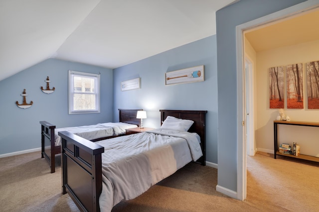 bedroom with light carpet, baseboards, and vaulted ceiling